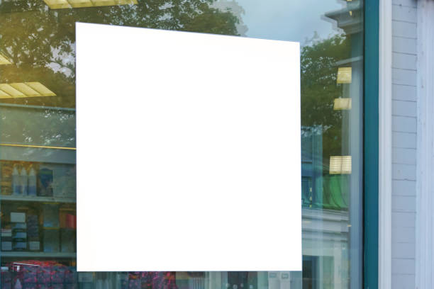 white sign on glass of window showcase shop mock-up advertising blank white sign on glass of window showcase shop outside on city street, mock-up store window stock pictures, royalty-free photos & images