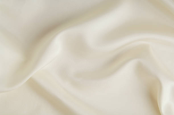 White silk background White silk background silk stock pictures, royalty-free photos & images