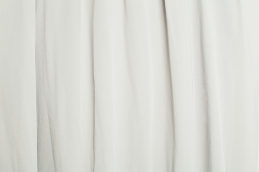 White silk smooth background. Fabric satin texture.
