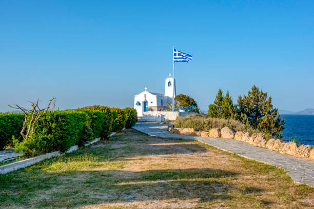 A  white small orthodox chapel dedicated to St.Nikolaos. Rafina,Greece stock photo