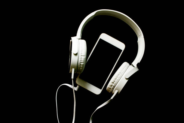 White smartphone and headphones banner template with text place. stock photo