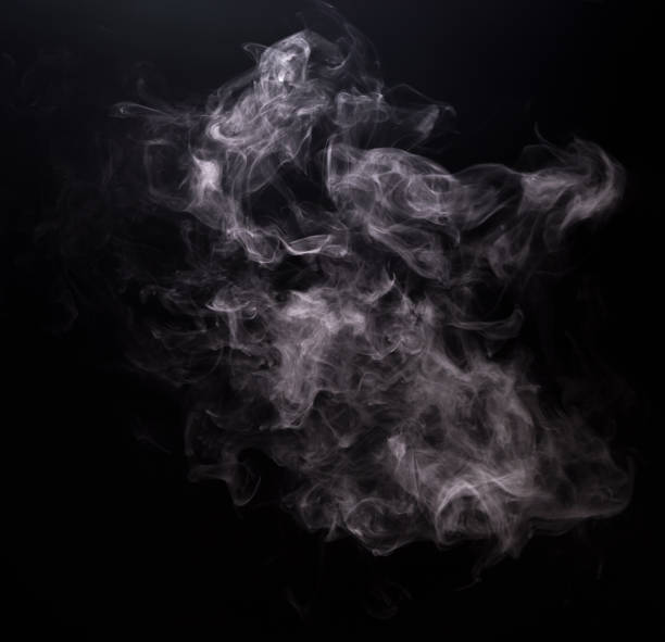 White smoke of vapor electronic cigarette White smoke of vapor electronic cigarette on black background wispy stock pictures, royalty-free photos & images