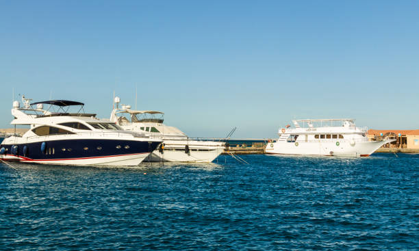 White snow yachts, standing at the pier in the Red Sea near Hurghada. stock photo