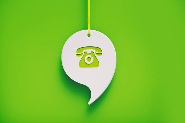 White Speech Bubble Imprinted with Telephone Symbol  Hanging over Green Background White speech bubble hanging over green background. Telephone symbol imprinted on chat bubble. Horizontal composition with copy space. smart phone green background stock pictures, royalty-free photos & images