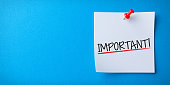 istock White Sticky Note With Important And Red Push Pin On Blue Background 1320842227