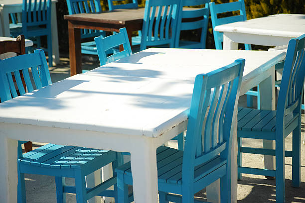 White Table With Blue Chairs Fisherman's Place In Bodrum stock photo