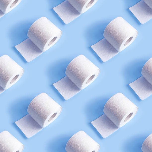 White toilet paper roll repeat seamless pattern on light blue background stock photo
