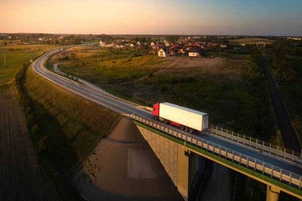 vit lastbil körning - european highway drone bildbanksfoton och bilder