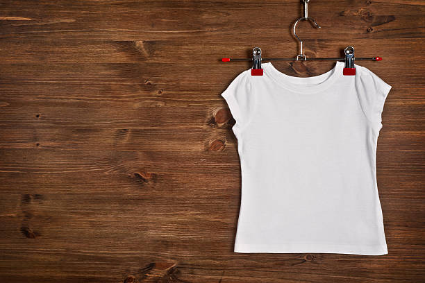 Download White T Shirt On Wood Background For Mockup Template 1948215 Stock Photo At Vecteezy
