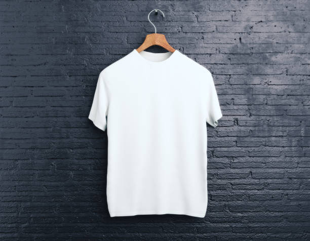 White t-shirt on brick background Wooden hanger with empty white t-shirt hanging on dark brick background. Shopping concept. Mock up. 3D Rendering blank t shirt stock pictures, royalty-free photos & images