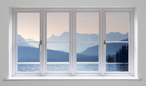 White window with lake view "A composite image of a white wooden double glazed modern window with a lake view in the background (Maligne Lake, Canada).Looking for a window Please see my window collection including cut-outs with clipping paths by clicking on the Lightbox Link below..." window frame stock pictures, royalty-free photos & images