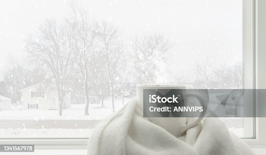 istock White winter concept of hot drink and winter accesseries 1341567978