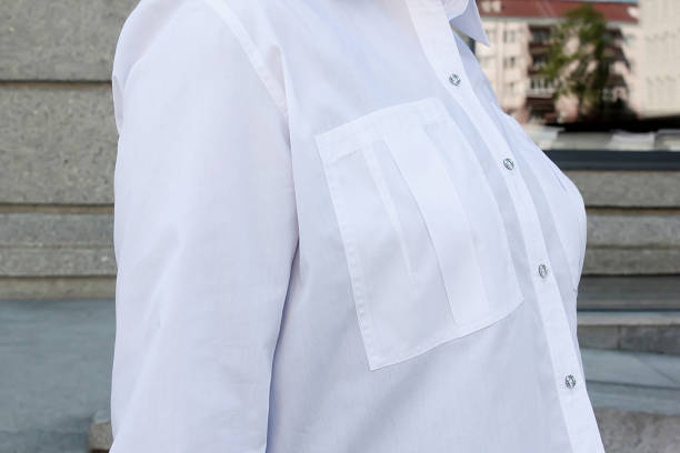 white women's blouse with patch pockets close-up shot white women's blouse with patch pockets close-up shot, casual style Simple, Professional Blouse stock pictures, royalty-free photos & images