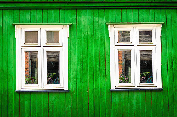 White wooden window with green front stock photo