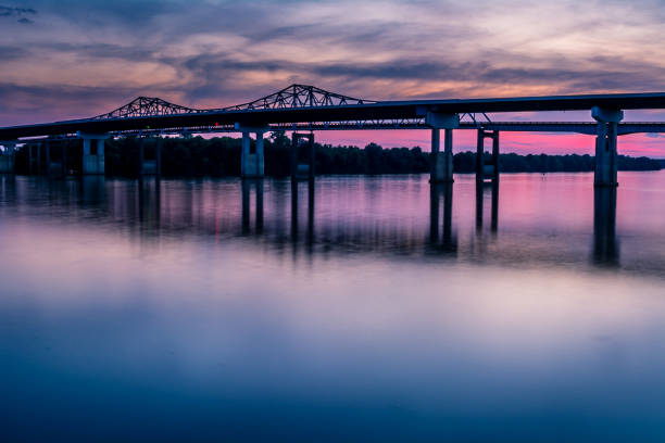 Whitesburg Bridge sunset Sunset at the Whitesburg Bridge crossing the Tennessee River in Huntsville, Alabama. tennessee river stock pictures, royalty-free photos & images