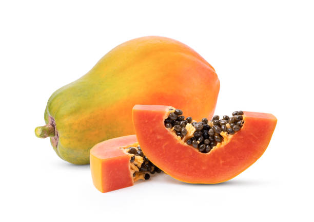 whole and half of ripe papaya fruit with seeds on white background whole and half of ripe papaya fruit with seeds isolated on white background papaya smoothie stock pictures, royalty-free photos & images