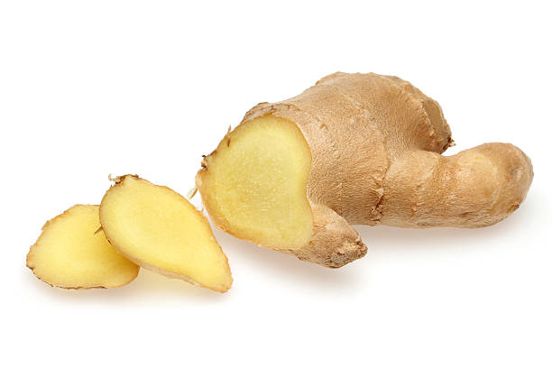 Whole and sliced ginger Whole and sliced ginger root in isolated white background ginger spice stock pictures, royalty-free photos & images