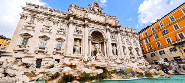 Wide angle view of the incredible Trevi Fountain in the city of Rome in Italy stock photo