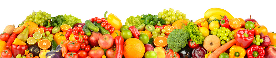 Wide panoramic composition of ripe, juicy fruits and vegetables isolated on white background.