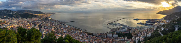 Wide panoramic view of Salerno and Gulf of Salerno seen from Arechi Castle at sunset, Campania, Italy stock photo