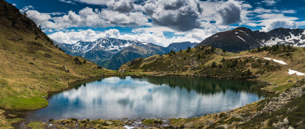 Wide panoramic vista over Tristaina lake,Andorra Wide panoramic vista over Tristaina lake in Pyrenees,Andorra free images for downloads stock pictures, royalty-free photos & images
