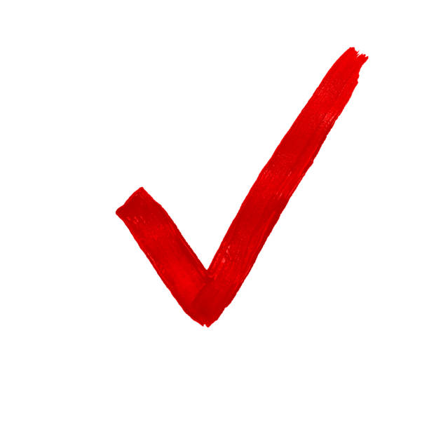 wide red tick drawn with a brush on white paper. Concept checklist stock photo