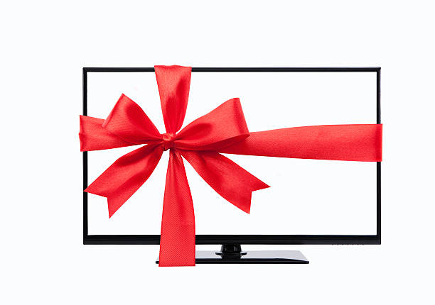 wide screen tv monitor tied with red ribbon stock photo