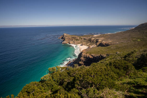A wide shot from cliff top to a stunning view of Dias beach and sea, Cape Point. stock photo