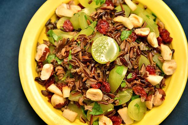 Wild rice salad with grapes and nuts stock photo