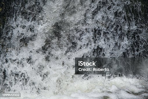 istock Wild swirling water caught on high speed shutter 1399412332