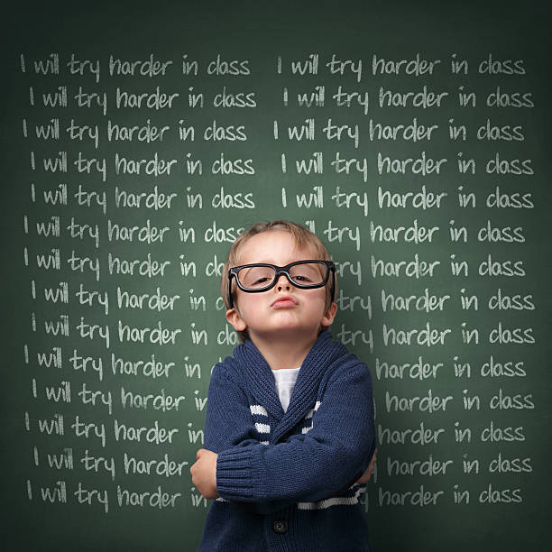 I will try harder in class Naughty schoolboy with lines written on a blackboard reading I will try harder in class. Detention and school discipline / punishment concept punishment stock pictures, royalty-free photos & images