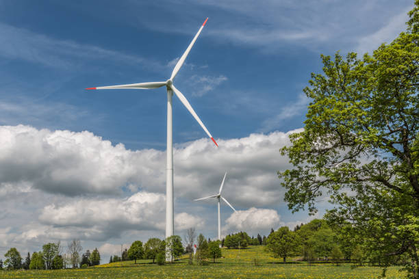 Wind turbine at Jura Mountains stock photo