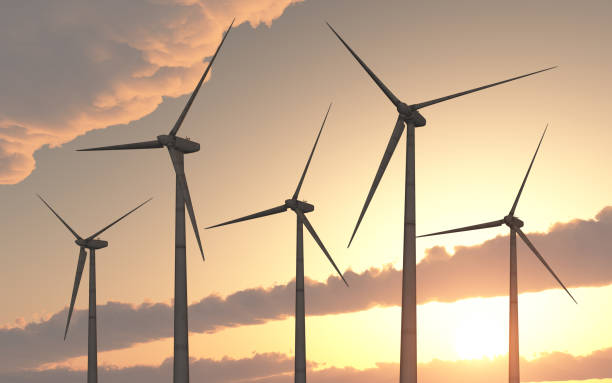 Wind turbines at sunset stock photo
