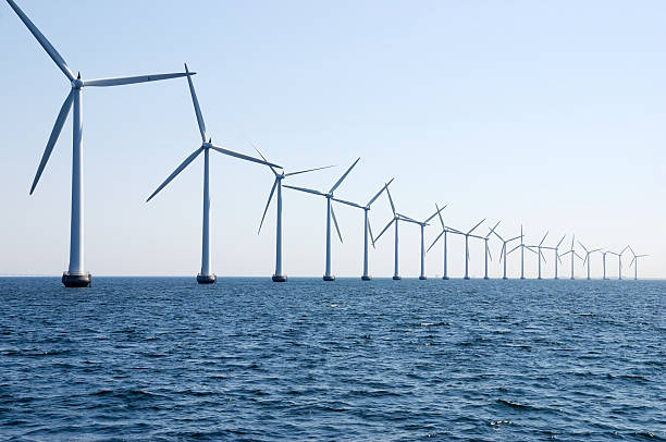 wind turbines in a row at sea outside Copenhagen stock photo