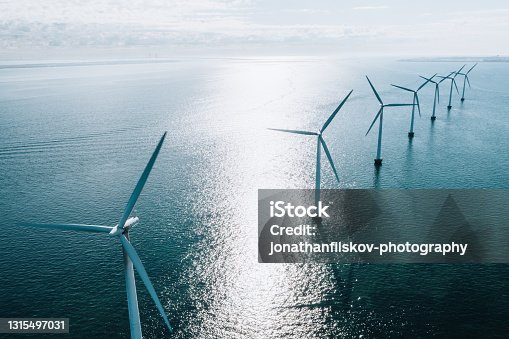 istock Wind turbines in the ocean 1315497031