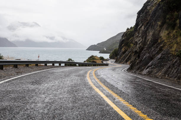 Winding road along the lake Wakatipu in New Zealand stock photo
