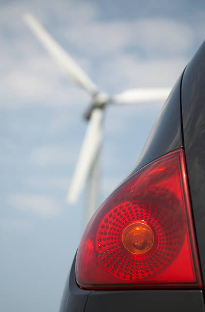 Windmill and car stock photo