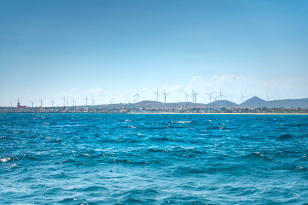 Windmill for electric power production, Wind turbines generating electricity on the sea at Binh Thuan, Vietnam. Clean energy concept stock photo