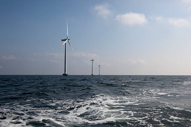 Windmills off shore stock photo