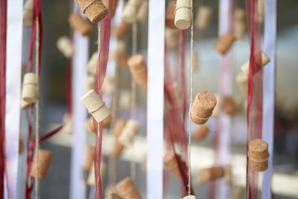 Window decoration made from wine corks and red ribbons stock photo