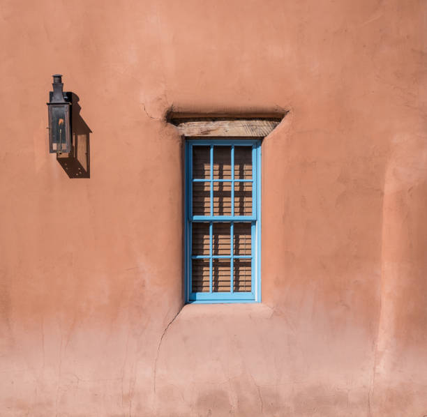 Window in Adobe Home Lantern and window in adobe home in Santa Fe, New Mexico adobe backgrounds stock pictures, royalty-free photos & images