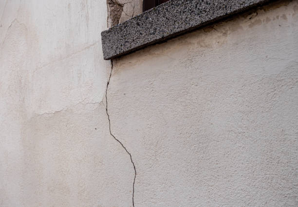 Window ledge crack structural damage stock photo