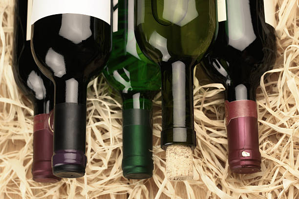 Wine bottles in straw stock photo