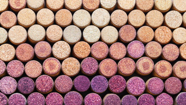 Wine corks background horizontal. Pattern of used wine corks. Color change from red to white. Wine stopper. Wine corks background horizontal. Pattern of used wine corks. Color change from red to white. Wine stopper. cork stopper stock pictures, royalty-free photos & images
