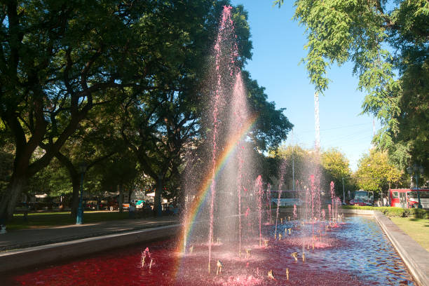 Wine fountain with rainbow stock photo