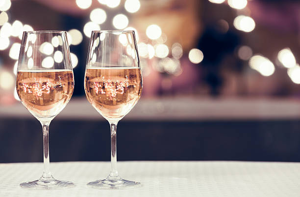 Wine tasting Wine glasses in a restaurant setting.  rose wine stock pictures, royalty-free photos & images