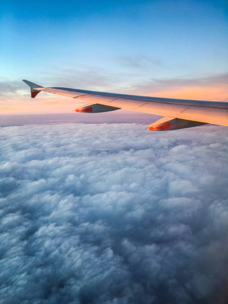 Wing of an Airplane at Sunset stock photo