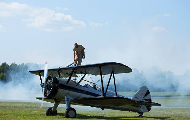 Wing Walker and Pilot Land at Flying Circus Aerodome stock photo