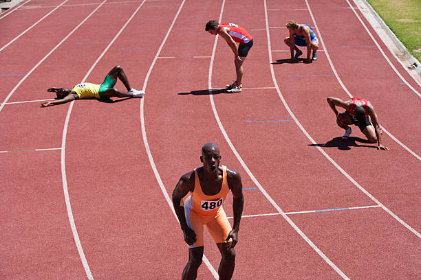 Tired Athlete Man Lying On Running Track Stock Photos ...