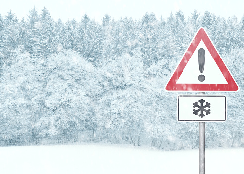 Winter Background - Snowy Landscape with Warning Sign